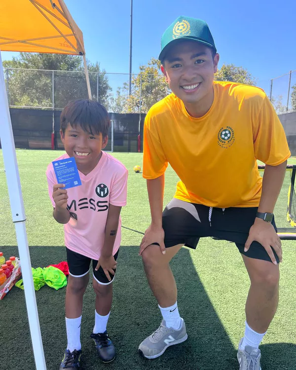 Kids practicing soccer skills